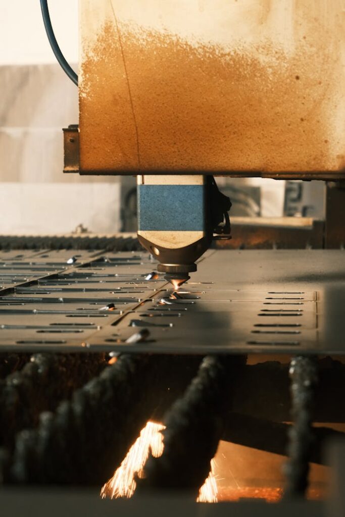 Close-up of laser cutting metal in an industrial factory.
